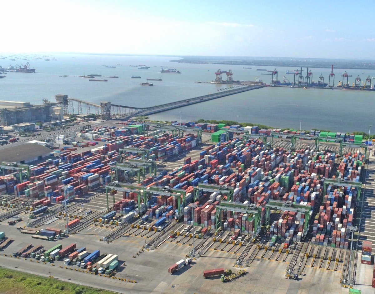 Aerial view of a global shipping port with containers